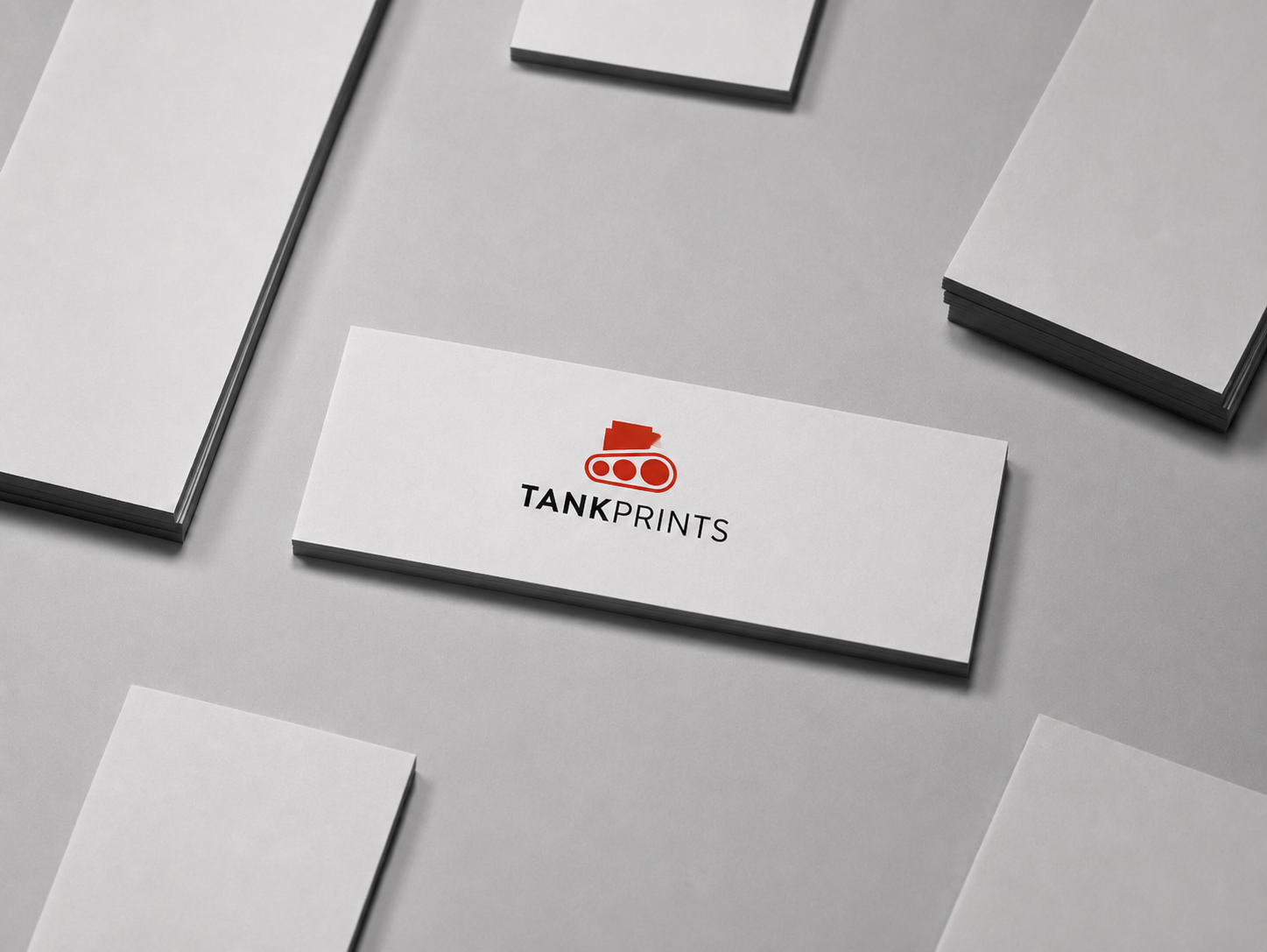 Horizontal 1.75" × 3.5" skinny business cards featuring the Tank Prints logo on premium white cardstock.